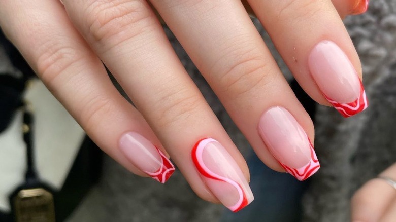 Red and pink swirl nails