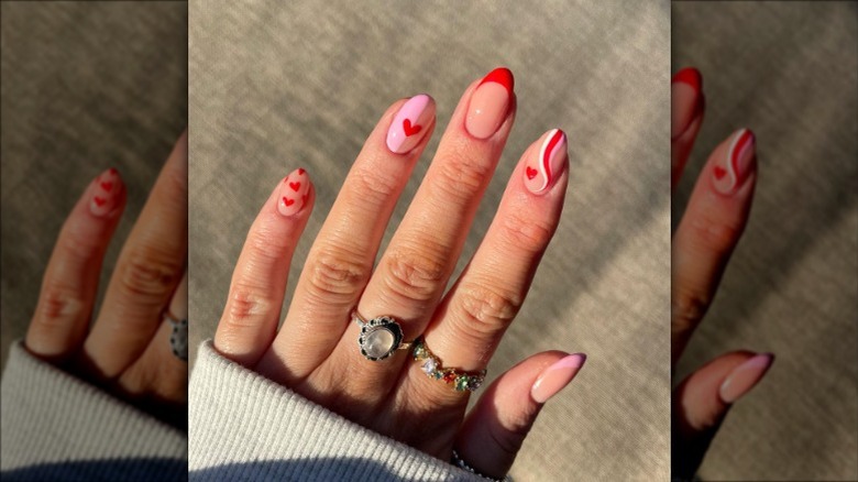 Pink and red heart swirl nails