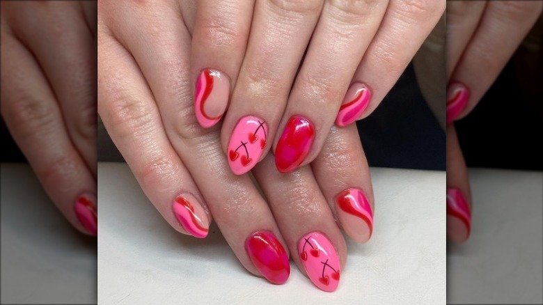 Pink and red heart swirl nails