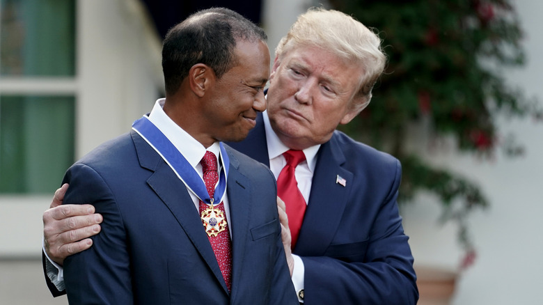 Donald Trump hugging Tiger Woods