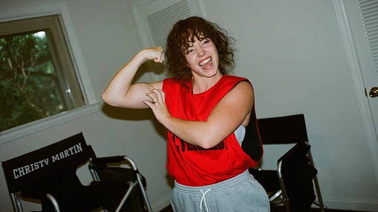 Sydney Sweeney showing off her bicep and new brunette mullet