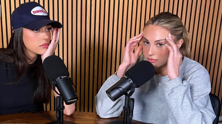 Sistine and Sophia Stallone looking stressed at microphones