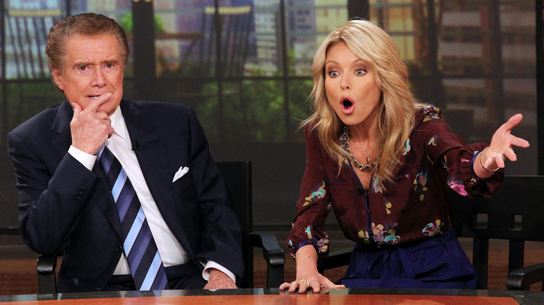 Regis Philbin and Kelly Rippa hosting their show