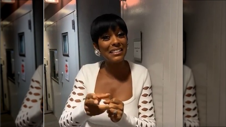 Tamron Hall backstage in white dress