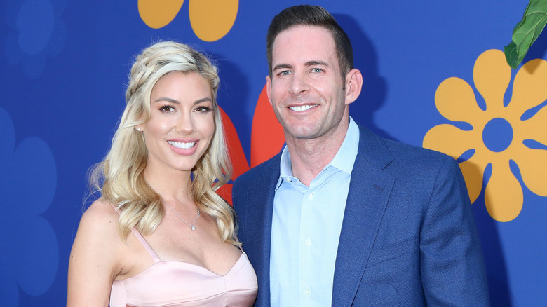 Tarek El Moussa Heather Rae Young posing 