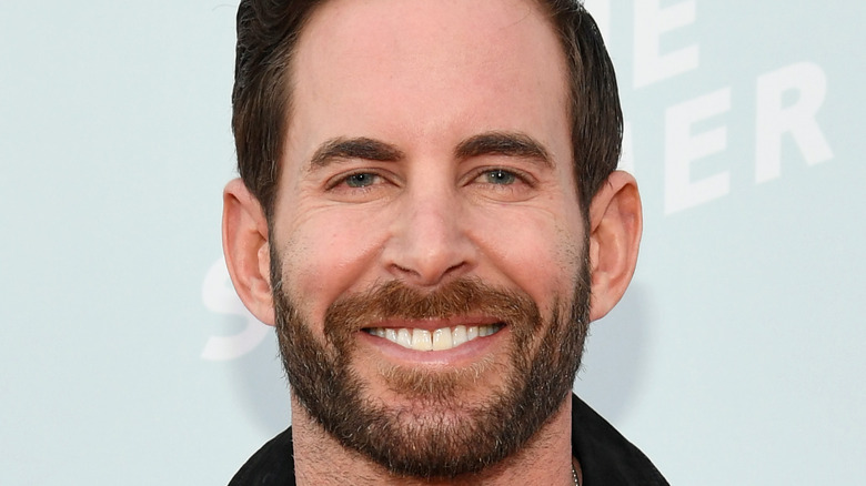 Tarek El Moussa smiles on the red carpet