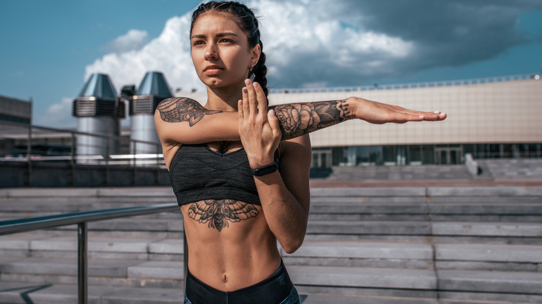 athletic woman with tattoos