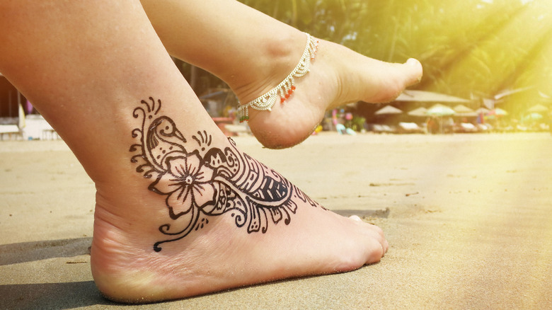 flower tattoo on foot