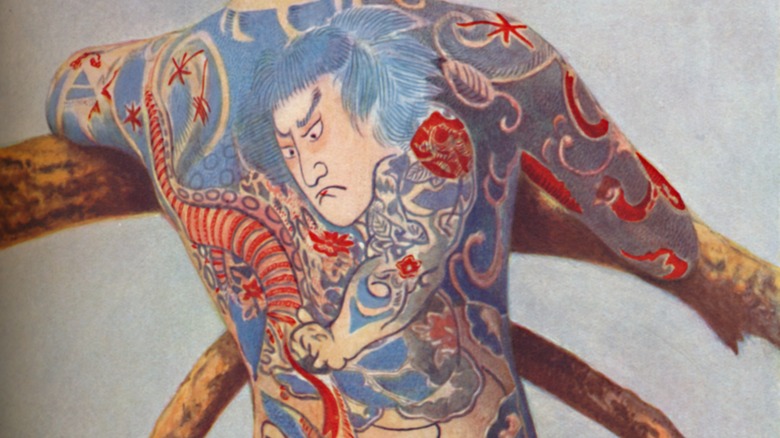 blue and red japanese style back tattoo