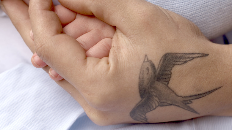 Bird tattoo on the hand