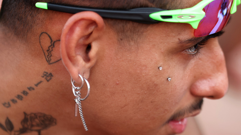 Man with Japanese neck tattoo