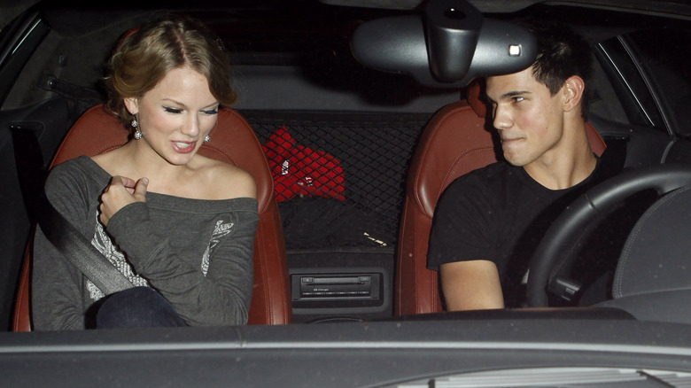 Taylor Swift and Taylor Lautner sitting in a car