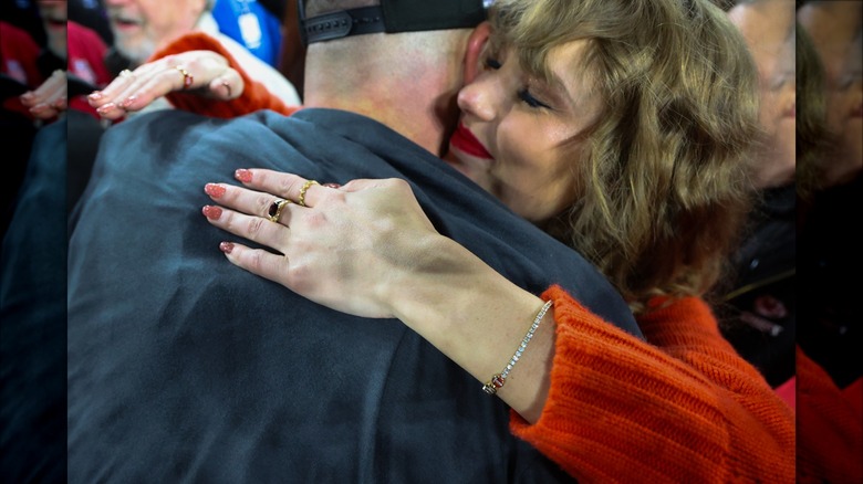 Travis Kelce hugging Taylor Swift