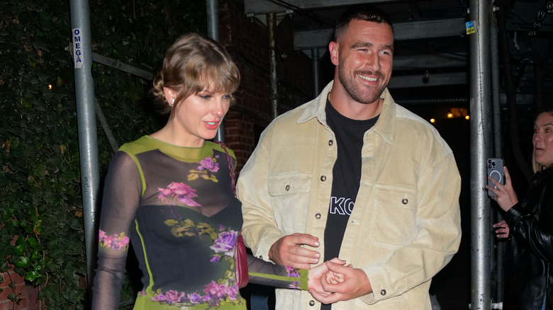 Travis Kelce and Taylor Swift walking together