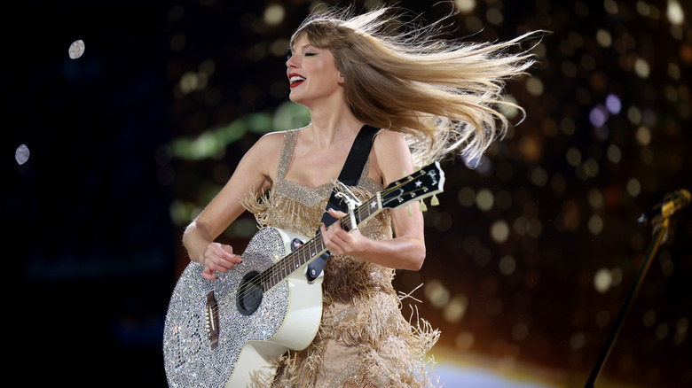 Taylor Swift playing guitar