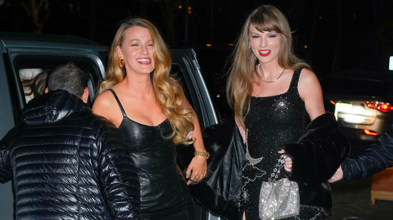 Taylor Swift laughing with Blake Lively