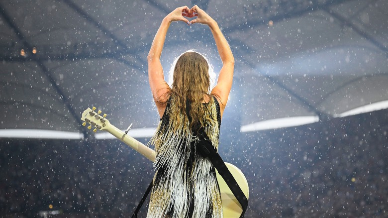 Taylor Swift making a hand heart at the Eras Tour