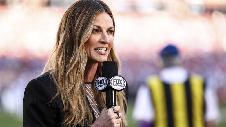 Erin Andrews speaks into microphone on field 