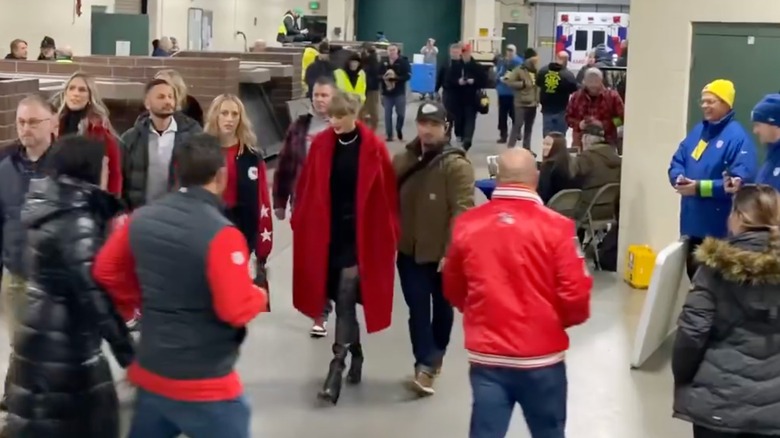 Taylor Swift in a red coat at the Chiefs game