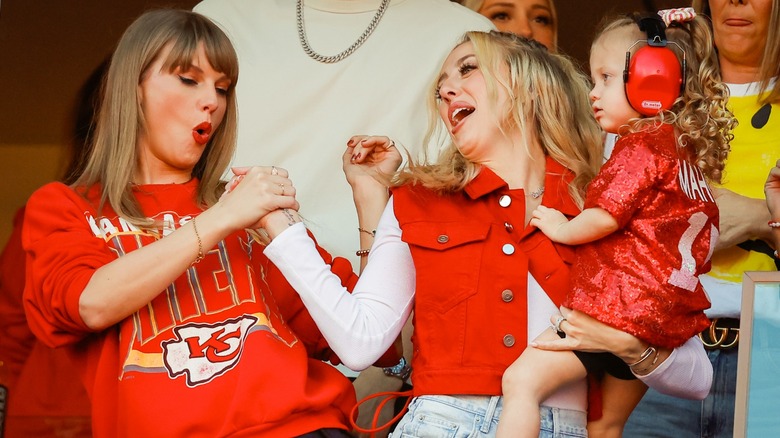 Taylor Swift and Brittany Mahomes shaking hands