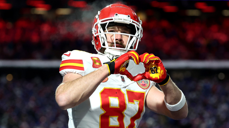 Travis Kelce making a hand heart