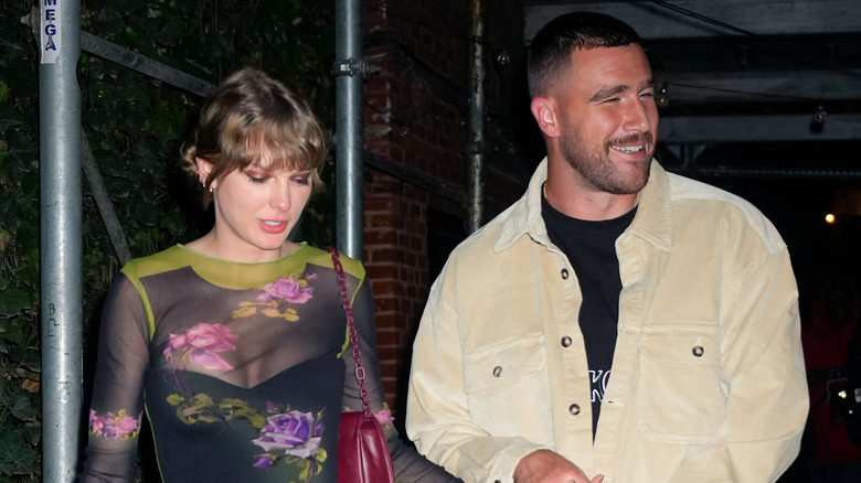 Taylor Swift and Travis Kelce walking together