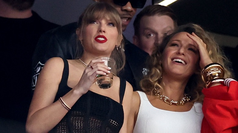 Taylor Swift holding drink, Blake Lively smiling