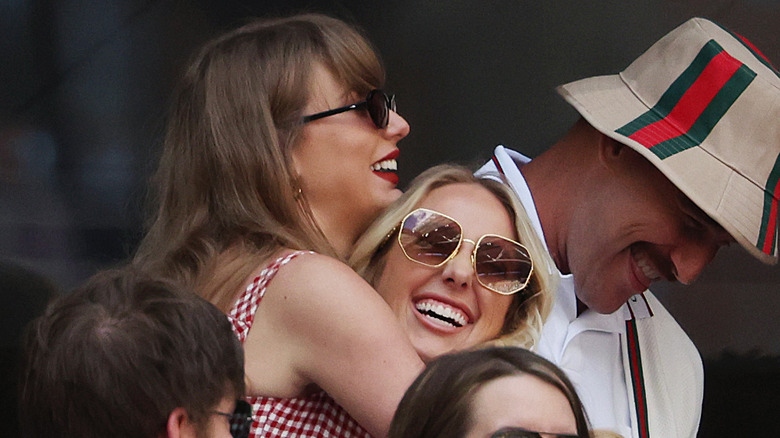 Taylor Swift hugging Brittany Mahomes in a crowd