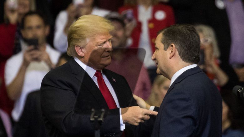 Donald Trump shaking hands with Ted Cruz