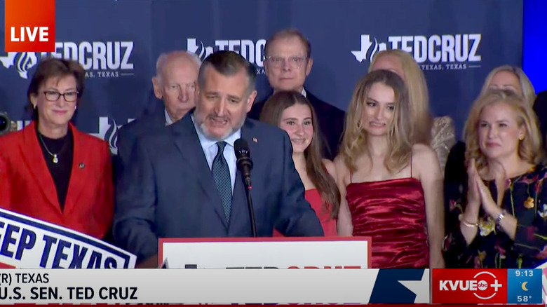 Ted Cruz victory speech, with Cruz at podium and daughter Caroline making a face next to him.