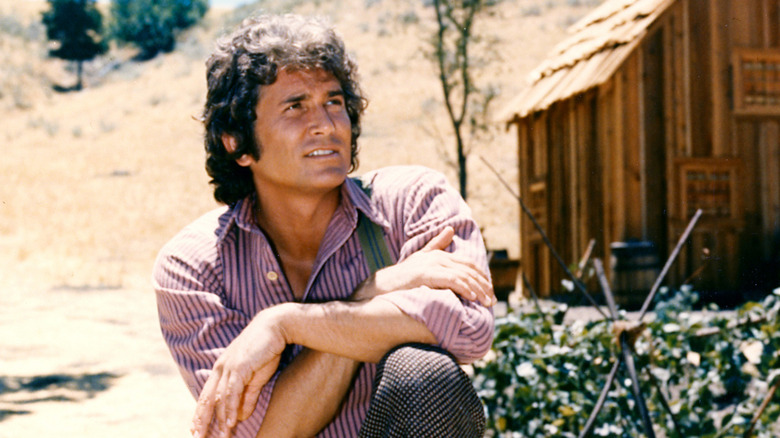 Michael Landon poses for a promo shot on the set of 'Little House on the Prairie' in 1974