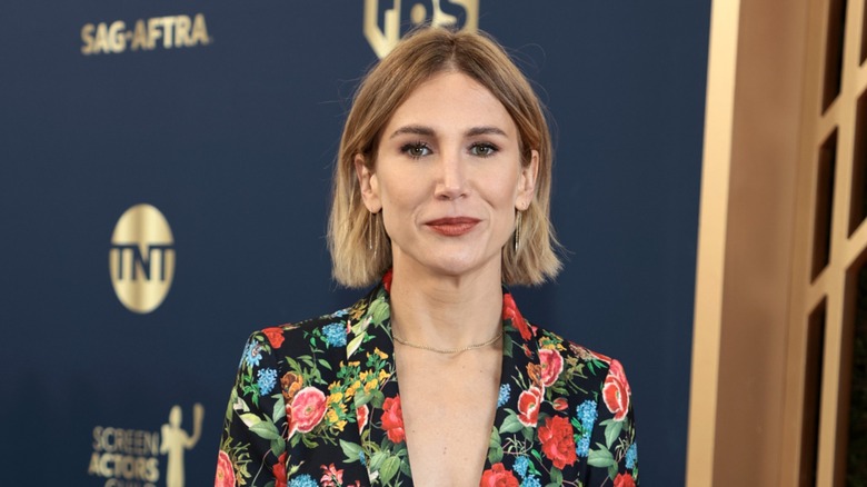 Jennifer Landon smiling in a floral suit