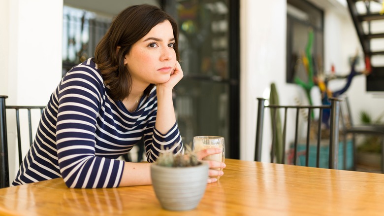 Sad woman waiting coffee shop