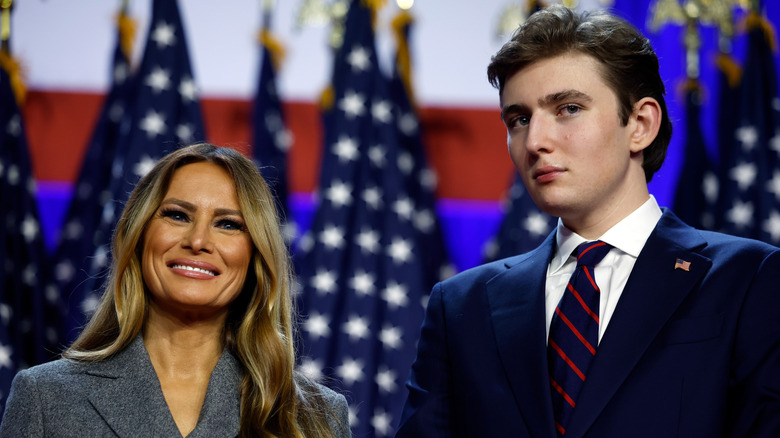 Melania Trump smiling next to Barron Trump