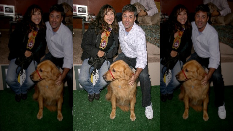 Robbi Morgan Walberg and Mark L. Walberg pose with dog