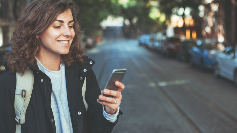 Woman sending text message