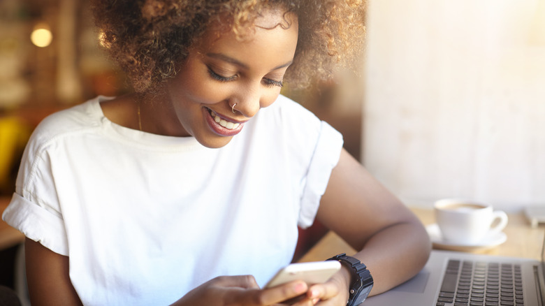 Woman sending a text message