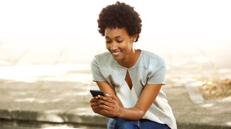 Woman sending text message