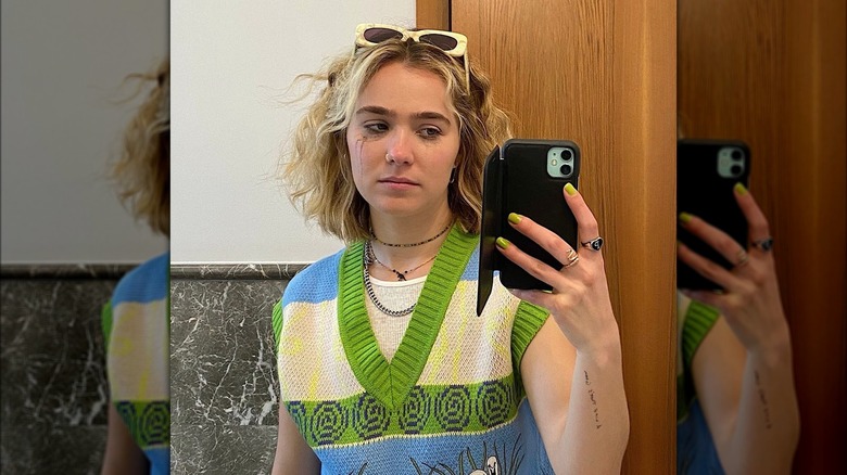 Haley Lu Richardson wearing chartreuse nail polish