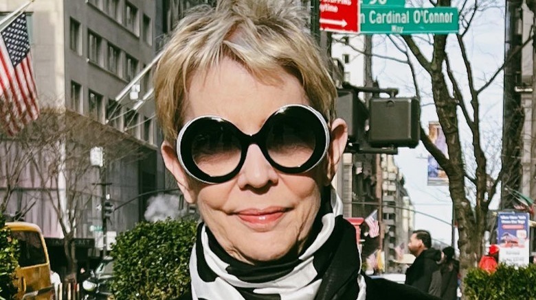 Woman wearing oversized round sunglasses