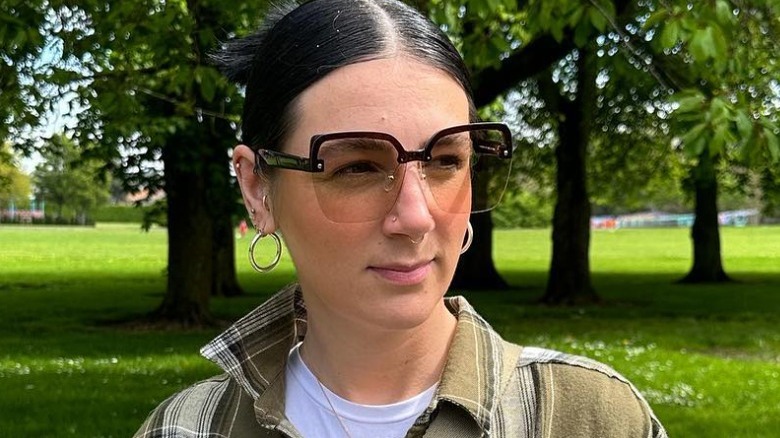 Woman wearing half-rim sunglasses