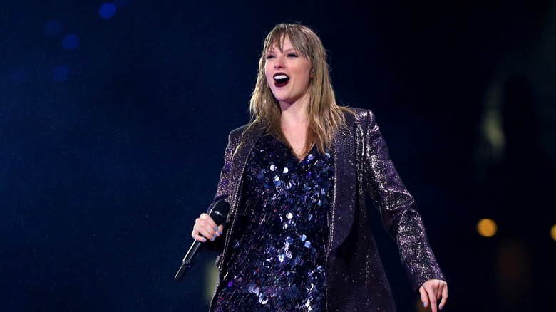 Taylor Swift smiling onstage during 'Reputation' Stadium Tour 2018