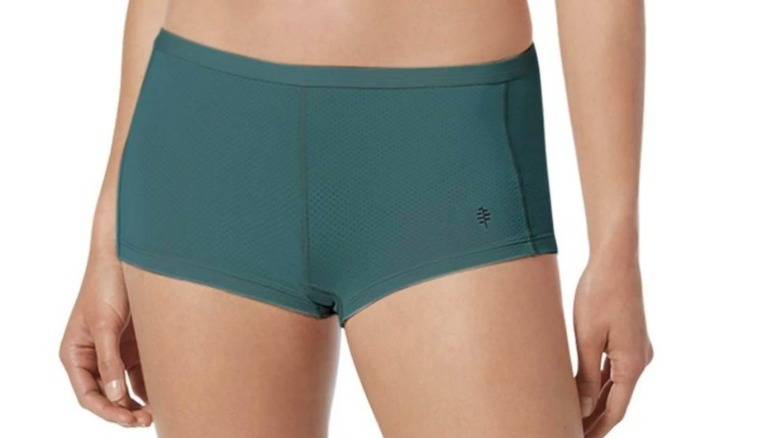 Model wearing teal boy-short style underwear