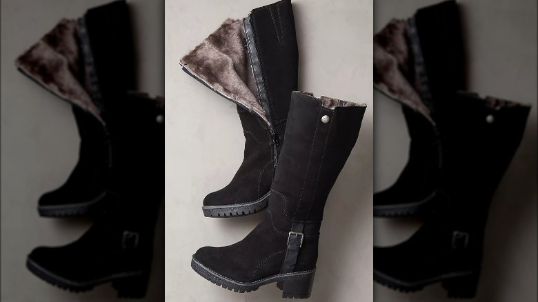 Tall black suede boots lined with shearling