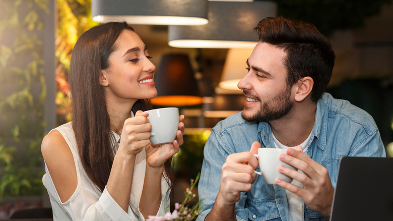 Dating couple having coffee