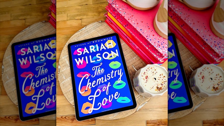 A reading tablet showing the cover of The Chemistry of Love