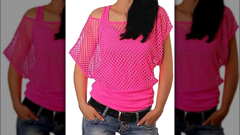 Model wearing neon pink fishnet t-shirt