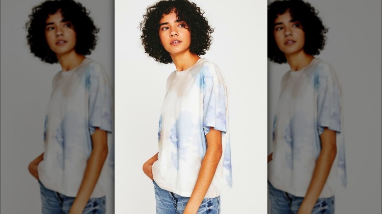 Model wearing blue tie dyed t-shirt