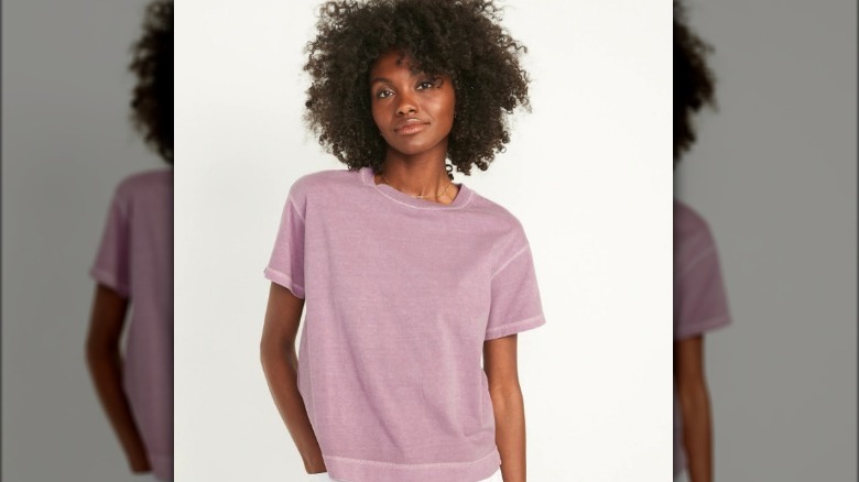 Model wearing loose pink t-shirt