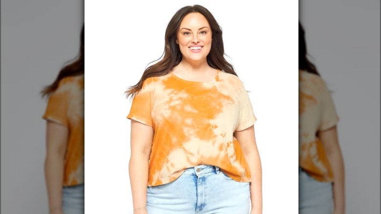 Model wearing orange tie-dyed t-shirt